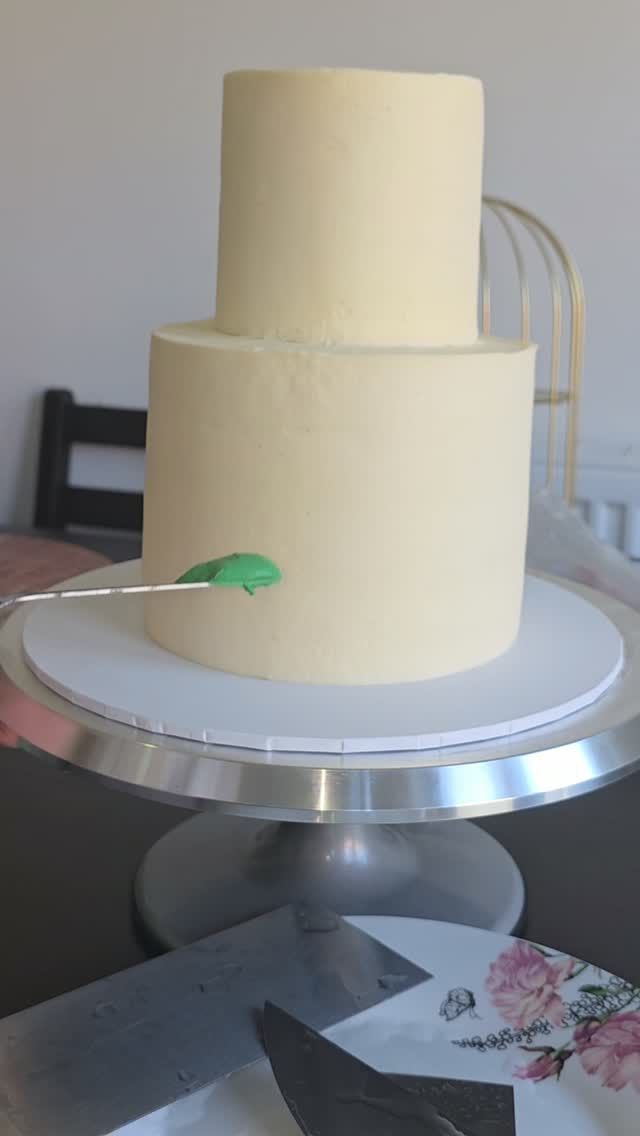 A tall two-tier cream celebration cake by SweetDreams, cakes by Athira